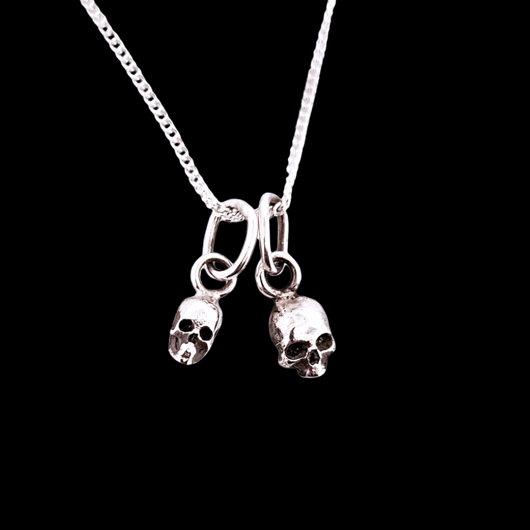 Collection of Cute Small Silver Skull Pendant in a gallery layout