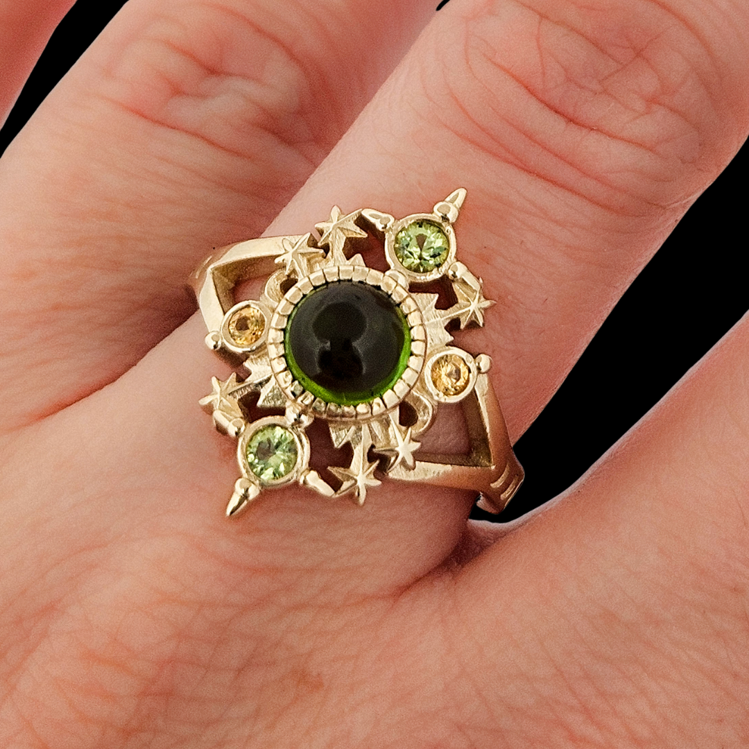 Collection of Alignement Ring - Gold, Green Tourmaline, Peridot and Yellow Sapphires in a gallery layout