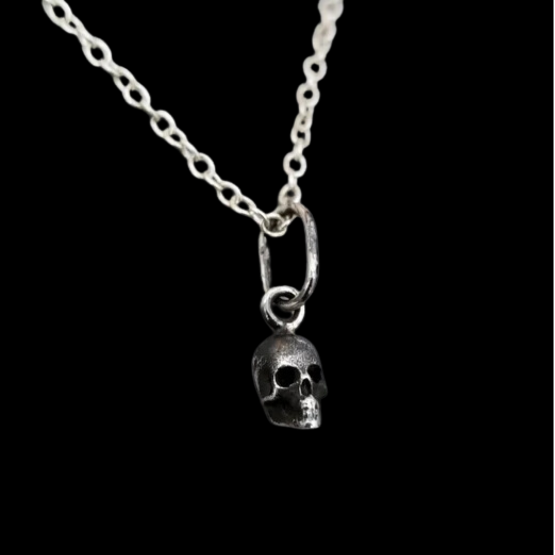 Collection of Tiny Silver Skull Pendant in a gallery layout