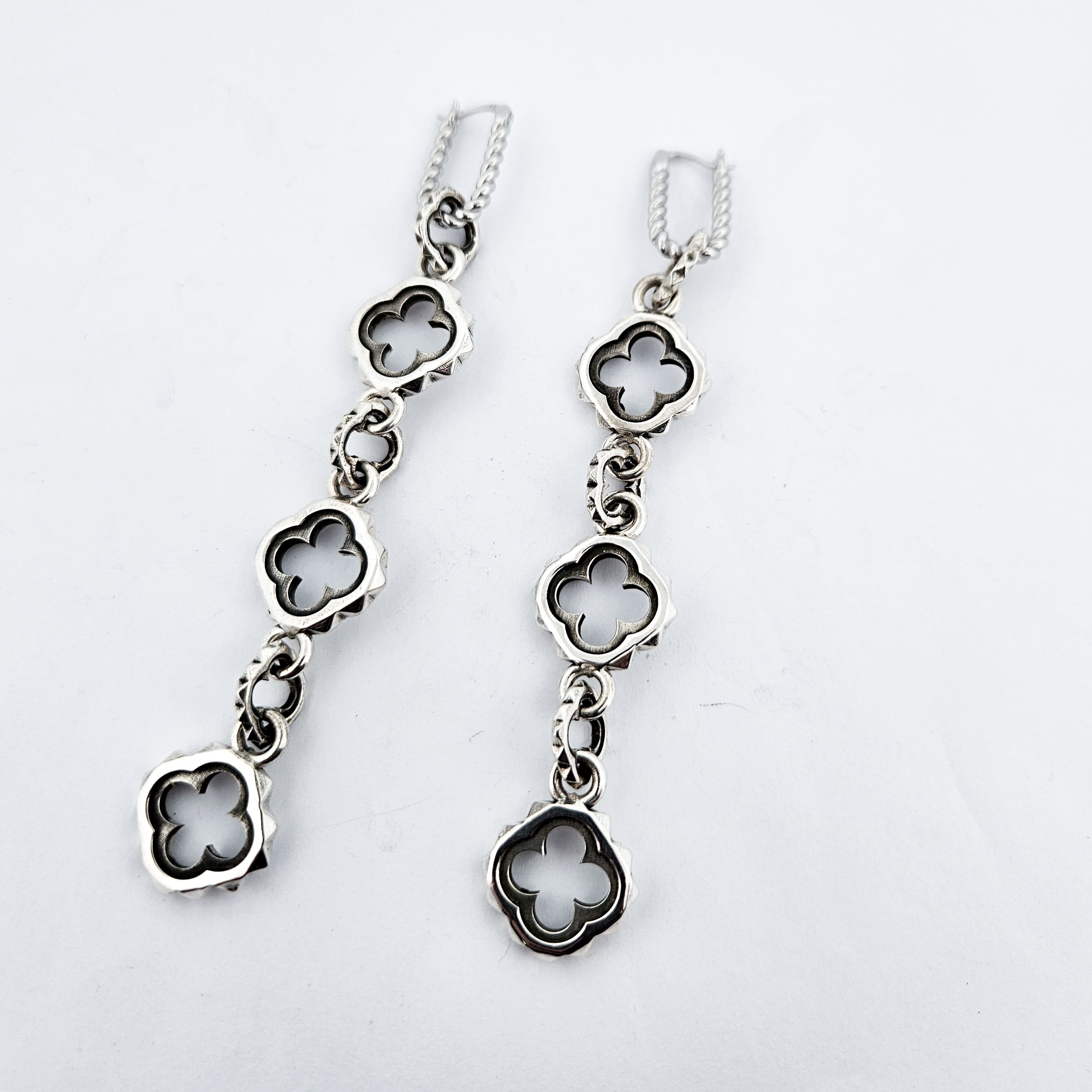 Collection of Quatre foils Dangling Silver Earrings in a gallery layout