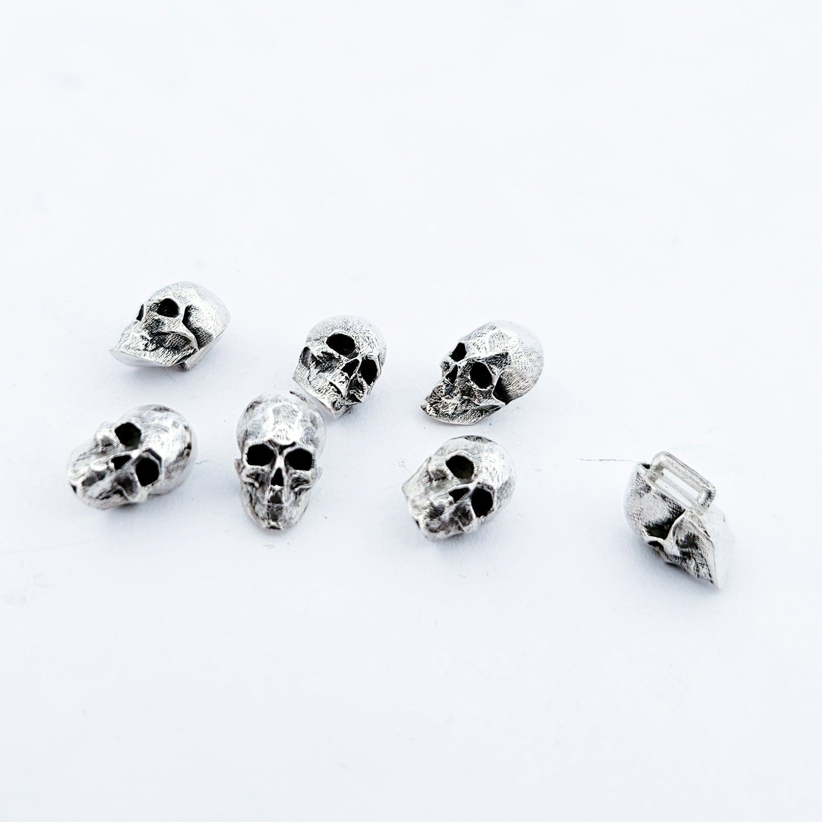 Collection of Sterling Silver Skull Buttons in a gallery layout