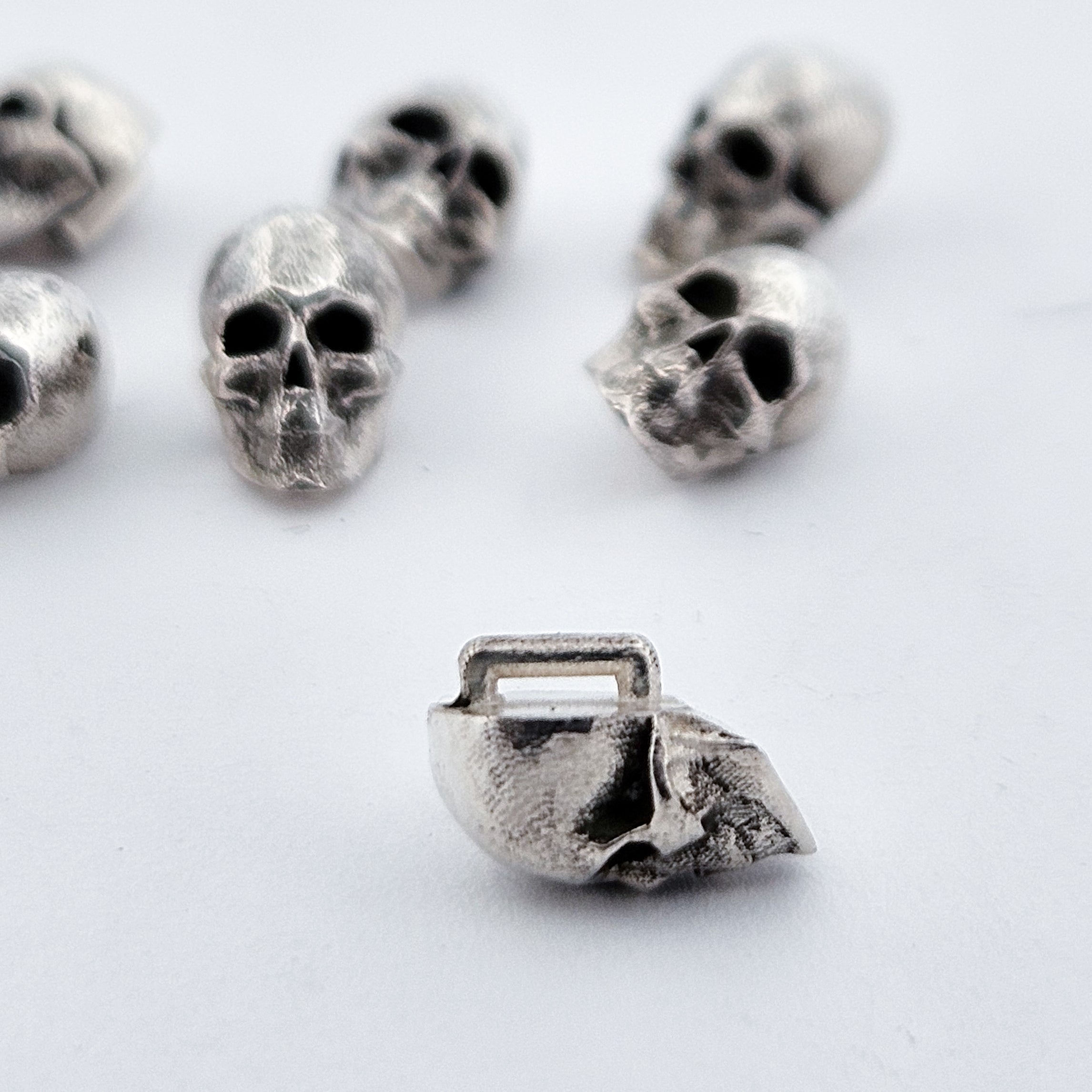 Collection of Sterling Silver Skull Buttons in a gallery layout