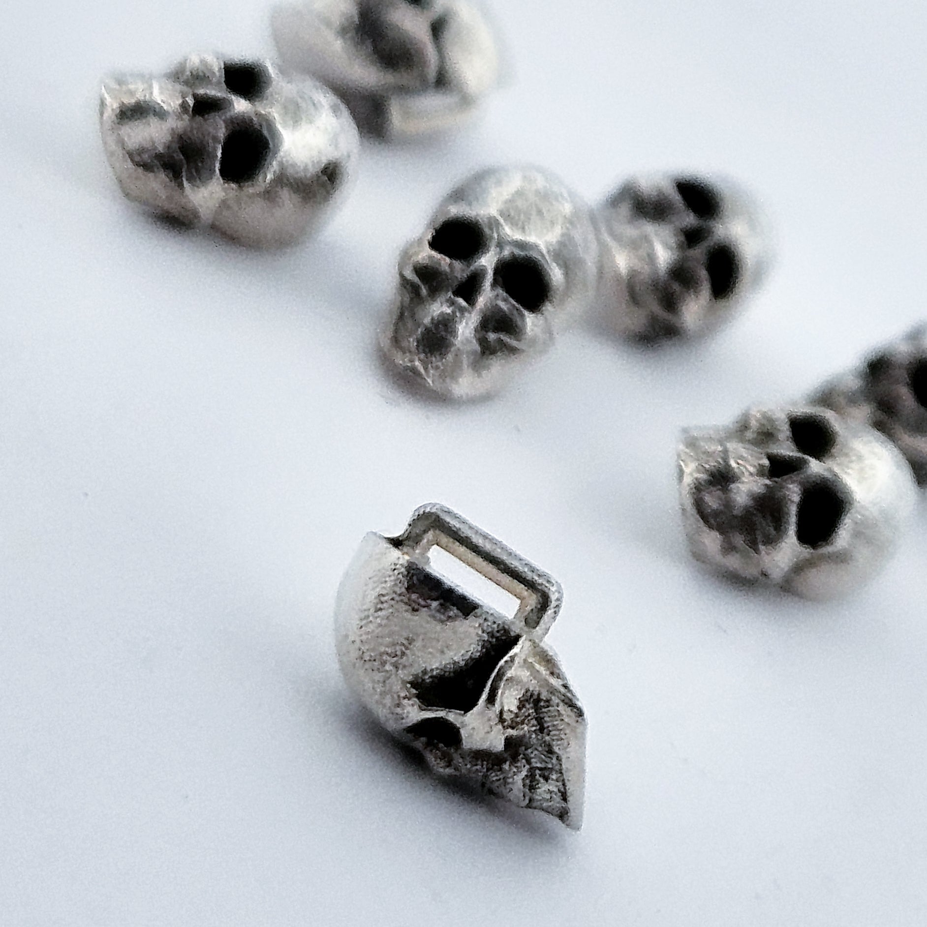 Collection of Sterling Silver Skull Buttons in a gallery layout