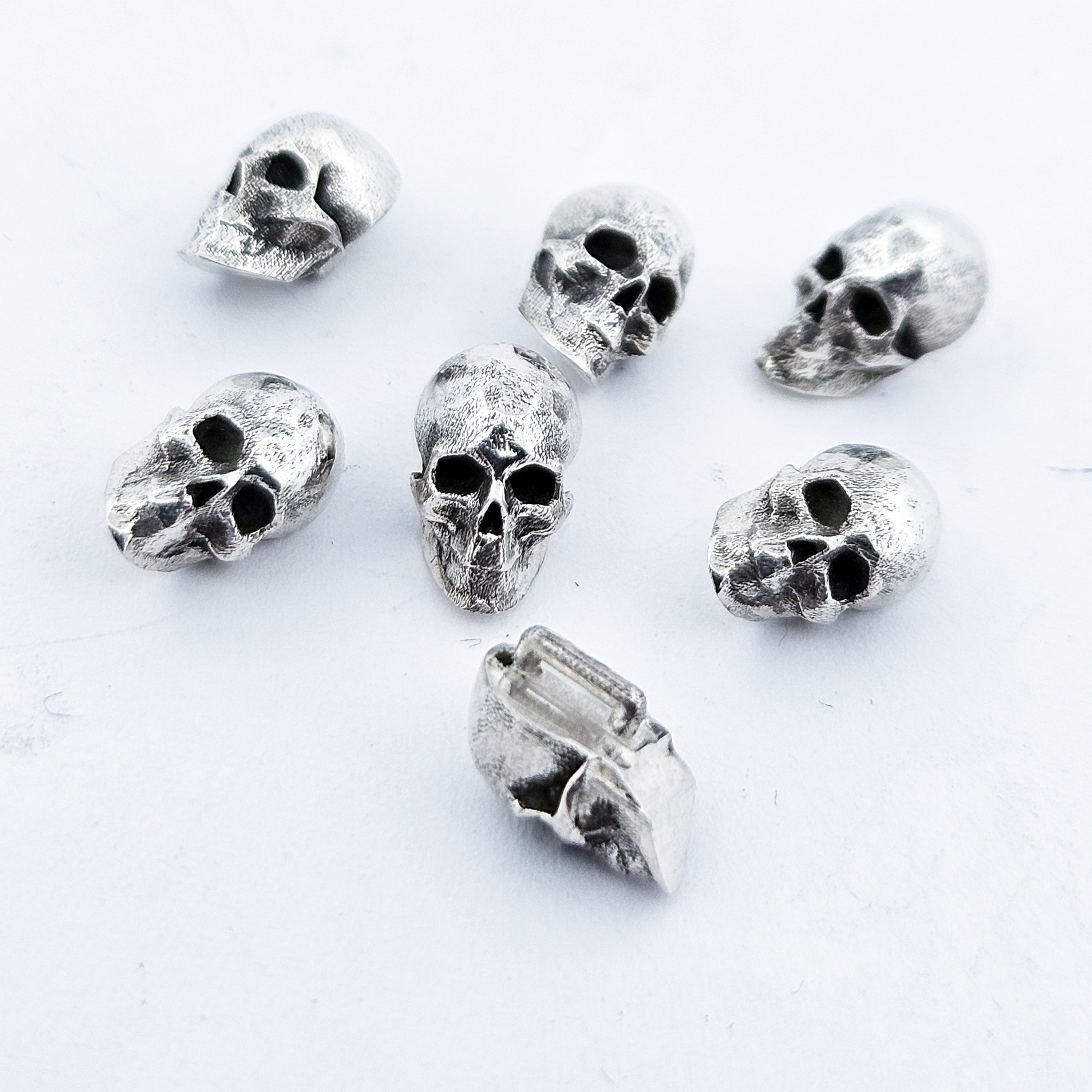 Collection of Sterling Silver Skull Buttons in a gallery layout