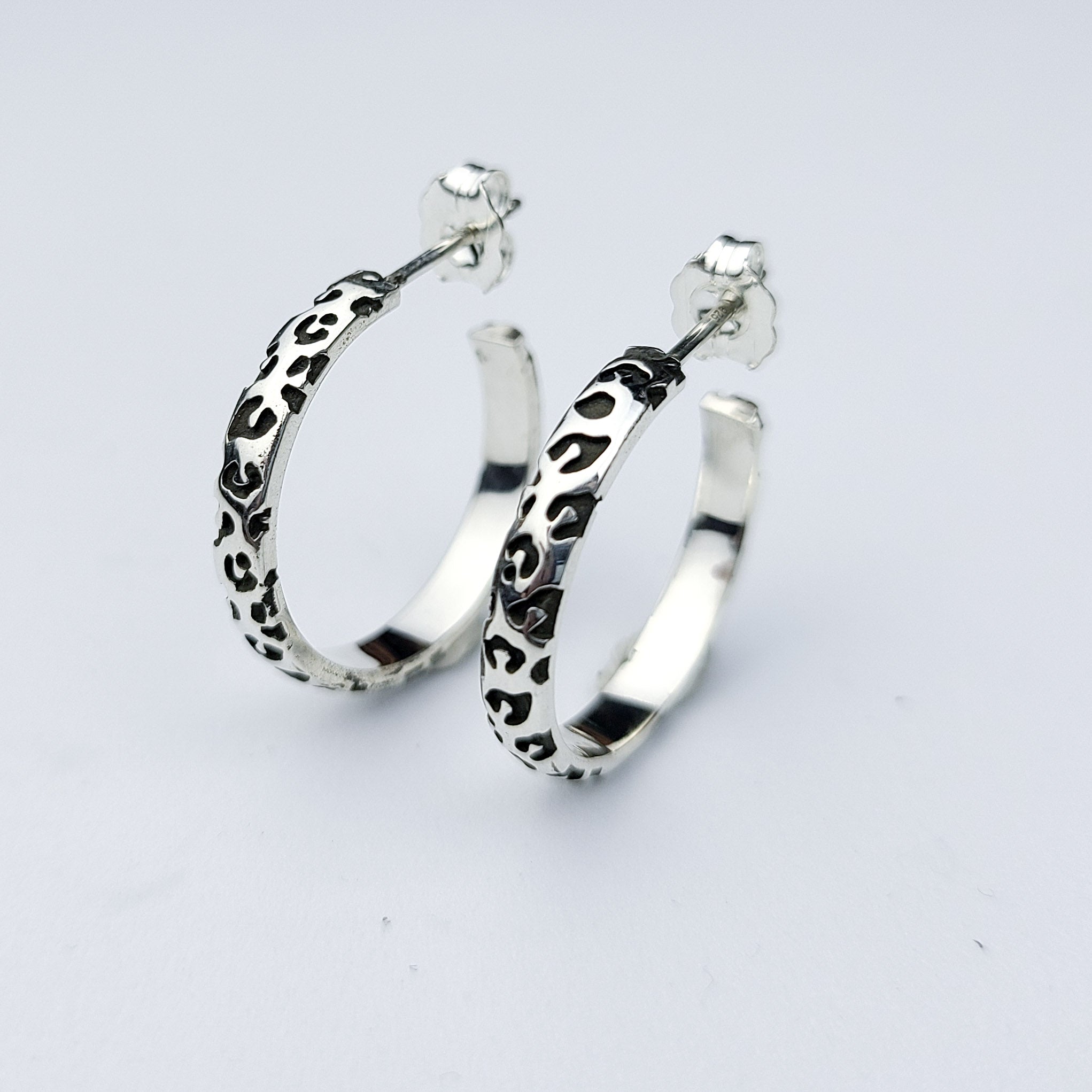 Collection of Thin Leopard Print Hoop Earrings in a gallery layout