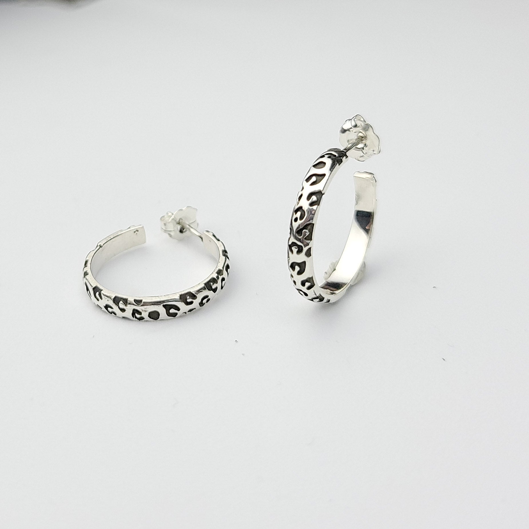 Collection of Thin Leopard Print Hoop Earrings in a gallery layout