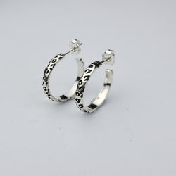 Collection of Thin Leopard Print Hoop Earrings in a gallery layout