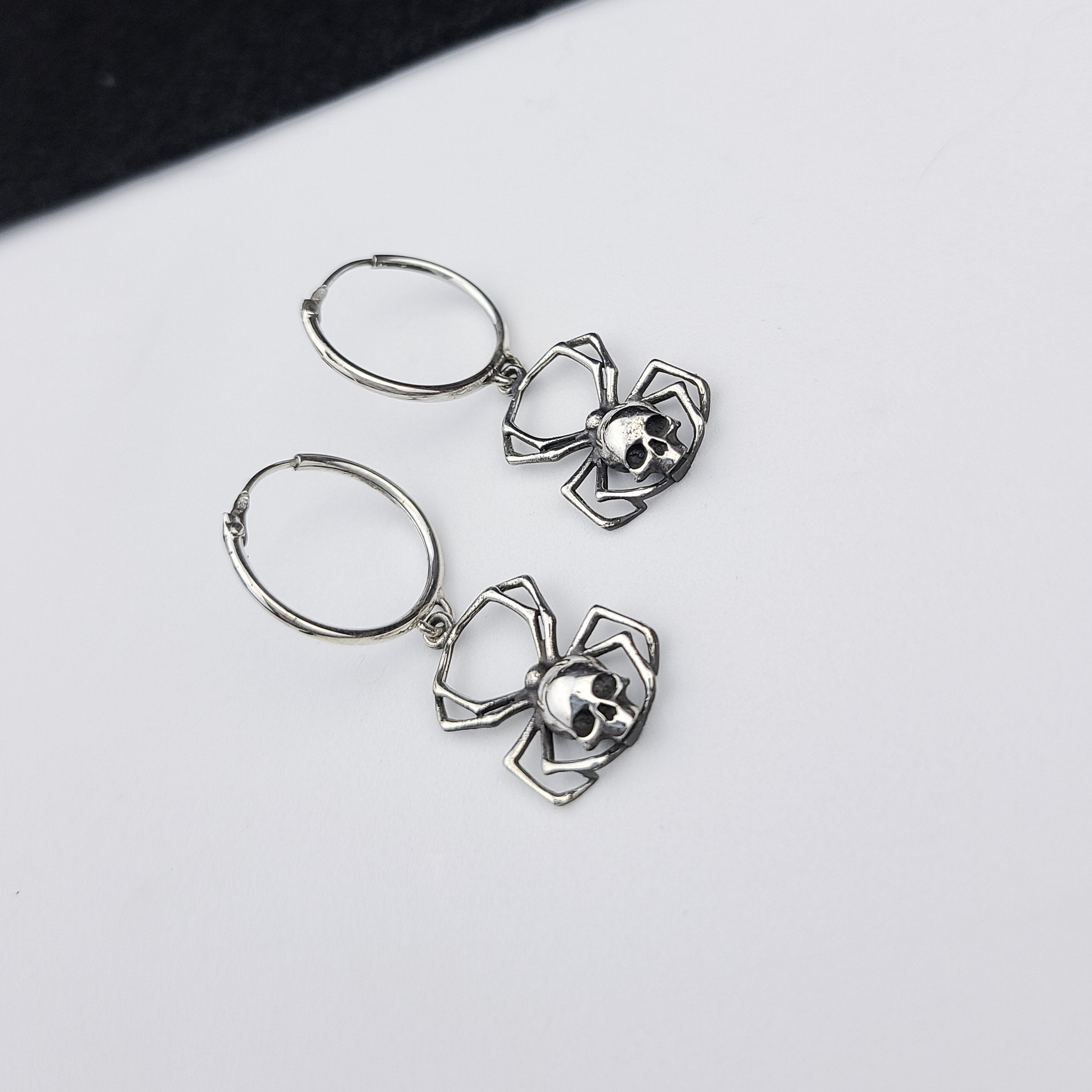 Collection of Skull Spider Hoops in Silver in a gallery layout