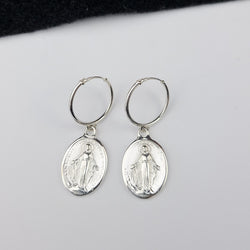 Collection of Oval Virgin Mary Medallion Hoop Earrings in a gallery layout