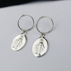 Collection of Oval Virgin Mary Medallion Hoop Earrings in a gallery layout