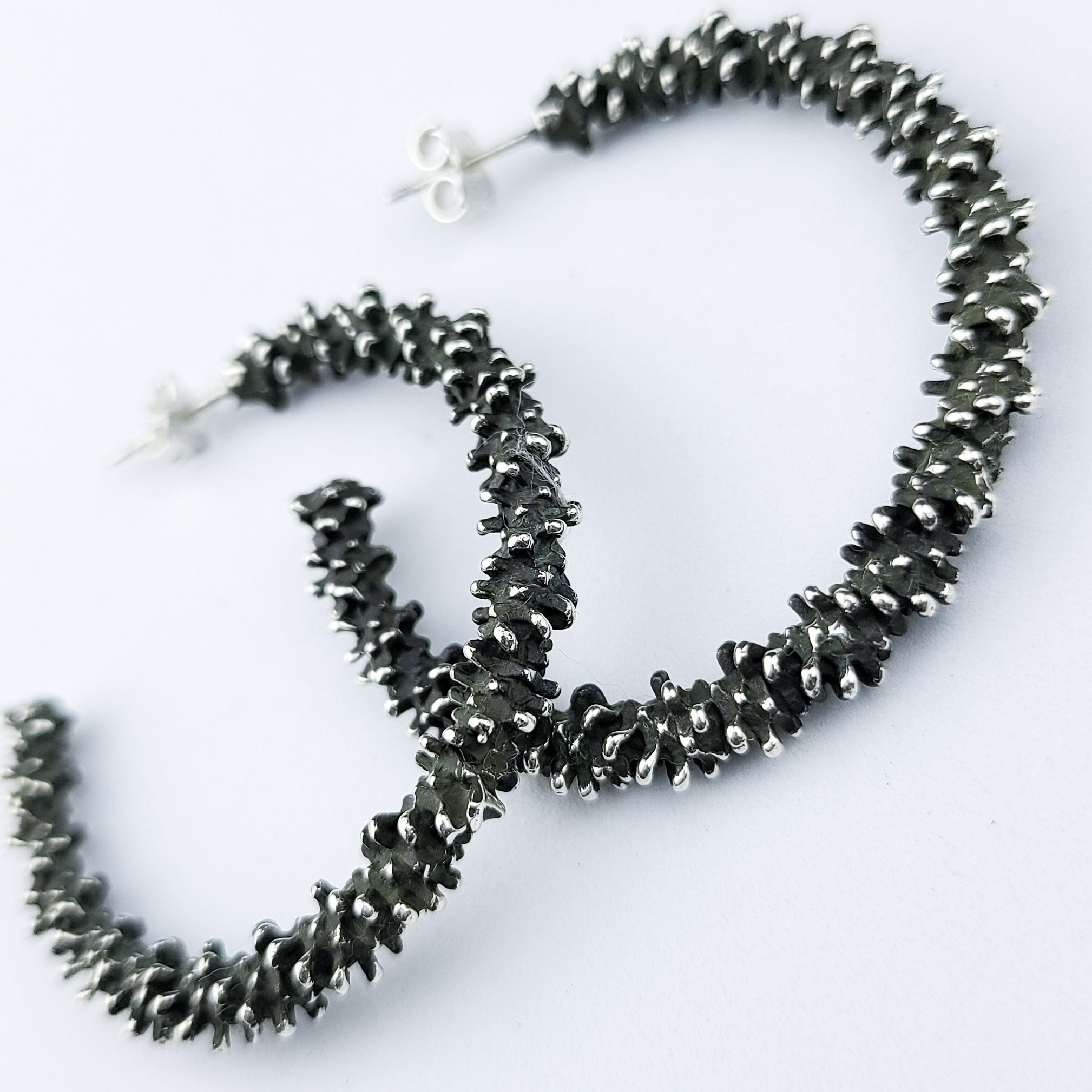 Collection of Silver Big Textured Hoops in a gallery layout