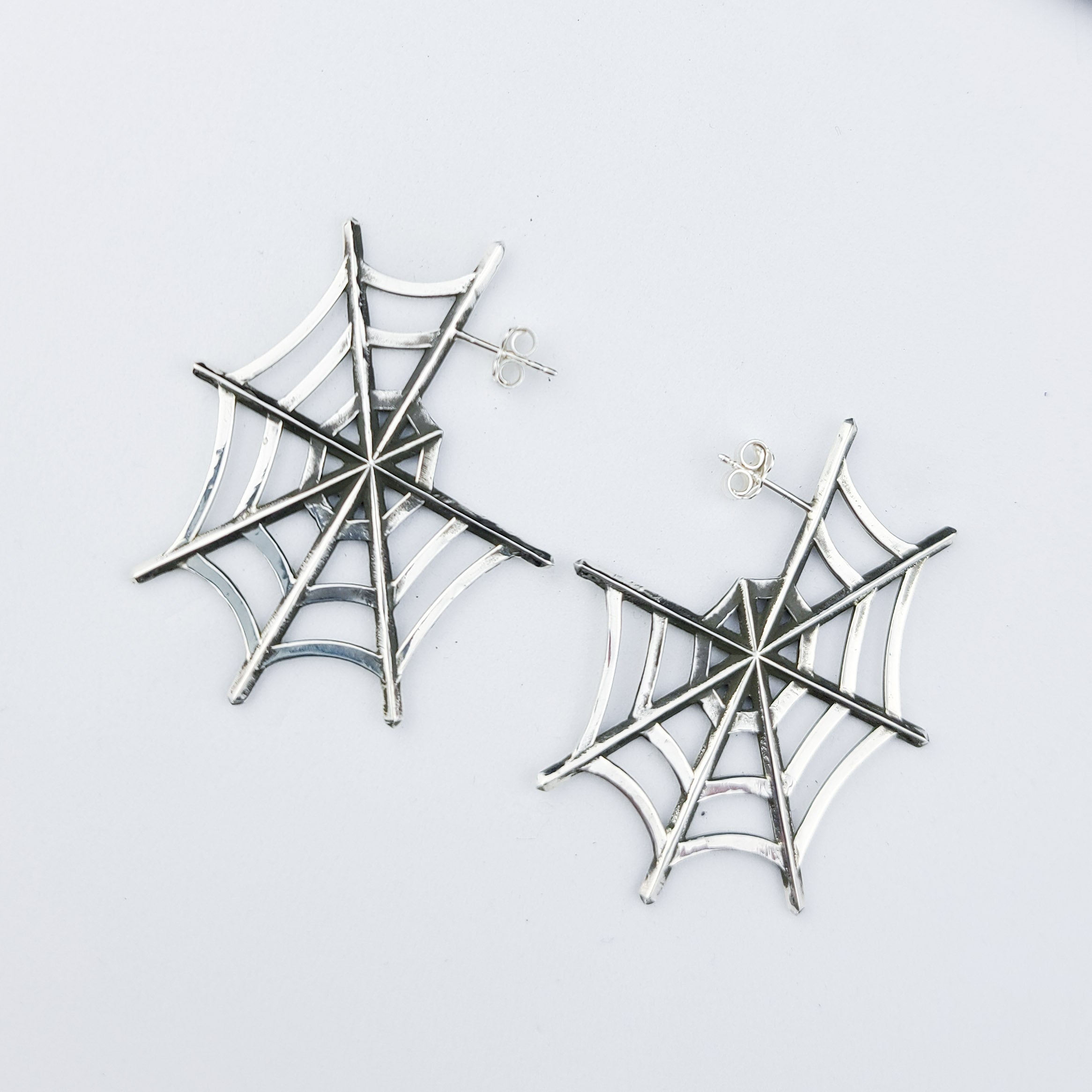 Collection of Silver Big Spider Web Hoops Earrings in a gallery layout