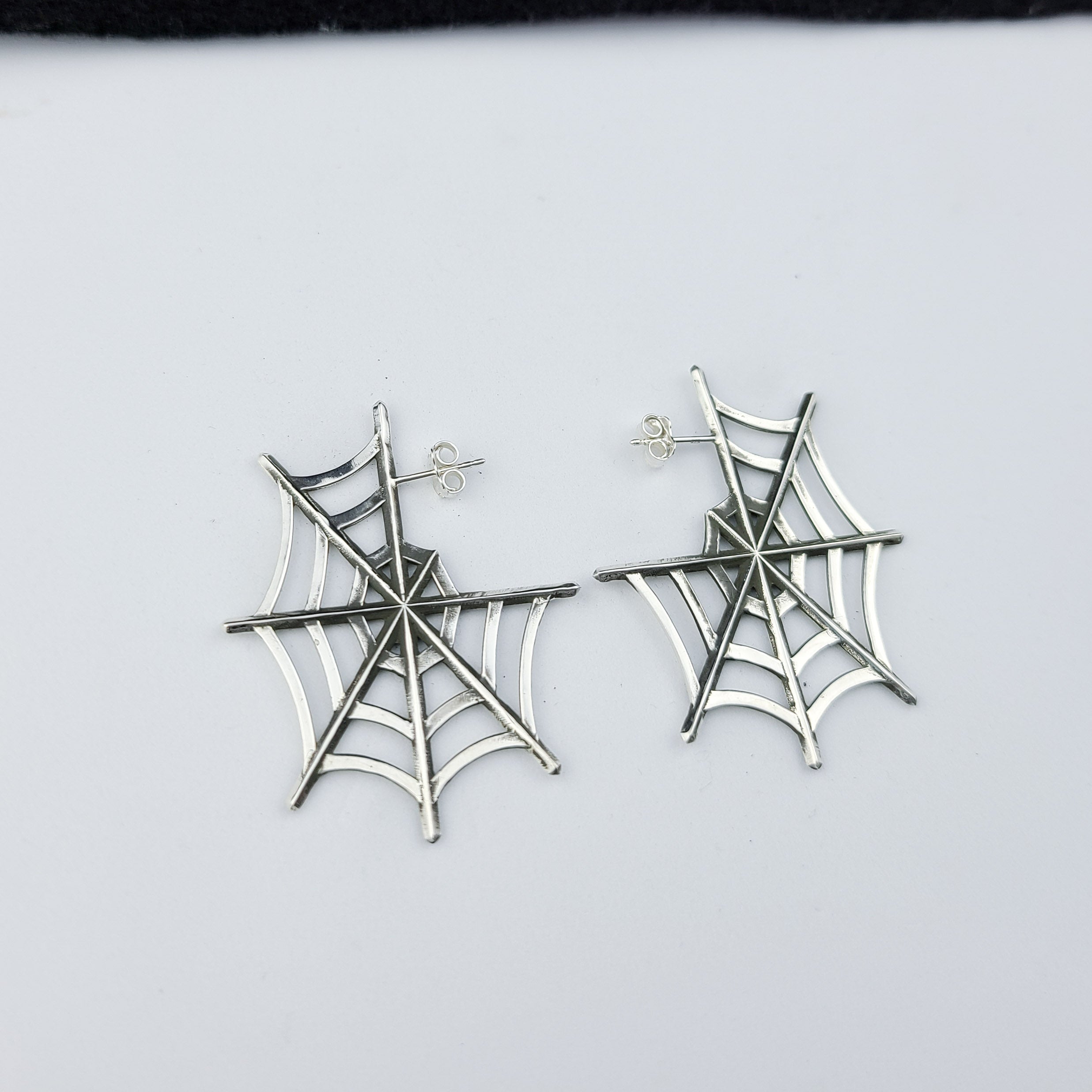 Collection of Silver Big Spider Web Hoops Earrings in a gallery layout