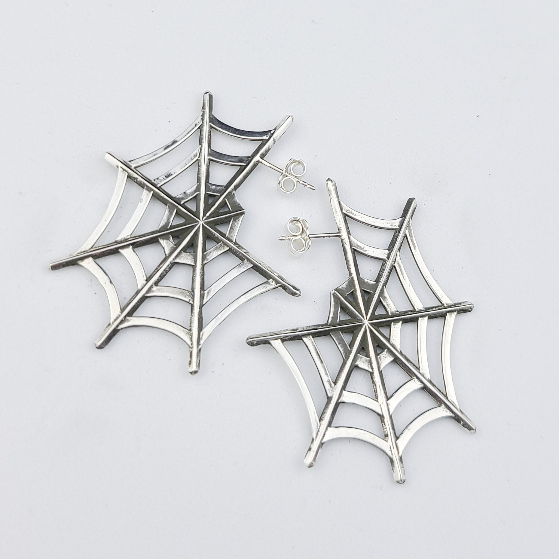 Collection of Silver Big Spider Web Hoops Earrings in a gallery layout