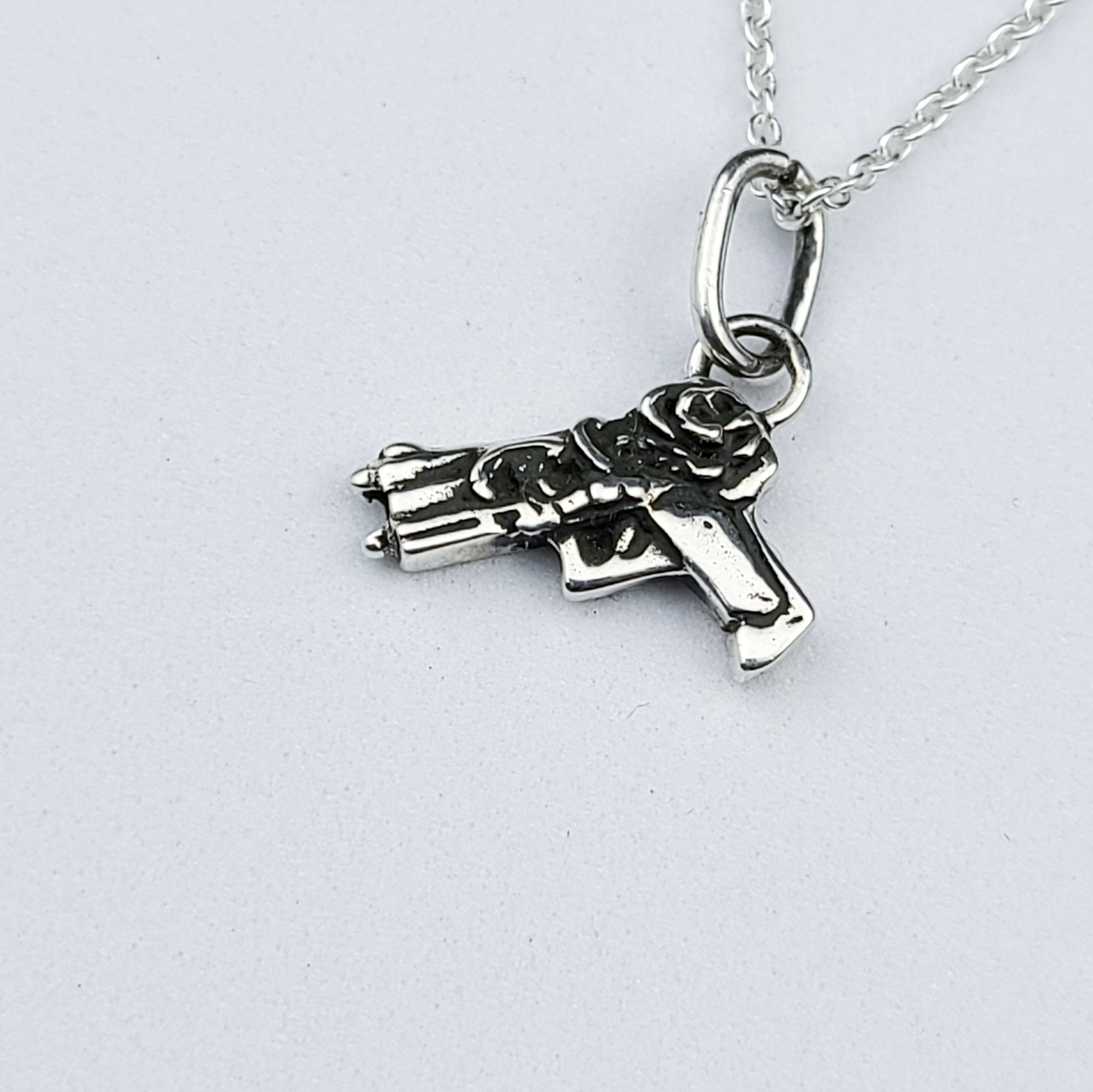 Tiny Silver Gun with Roses Pendant