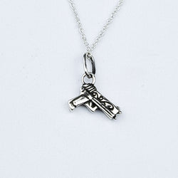 Collection of Petit Pistolet en Argent avec Pendentif Roses in a gallery layout