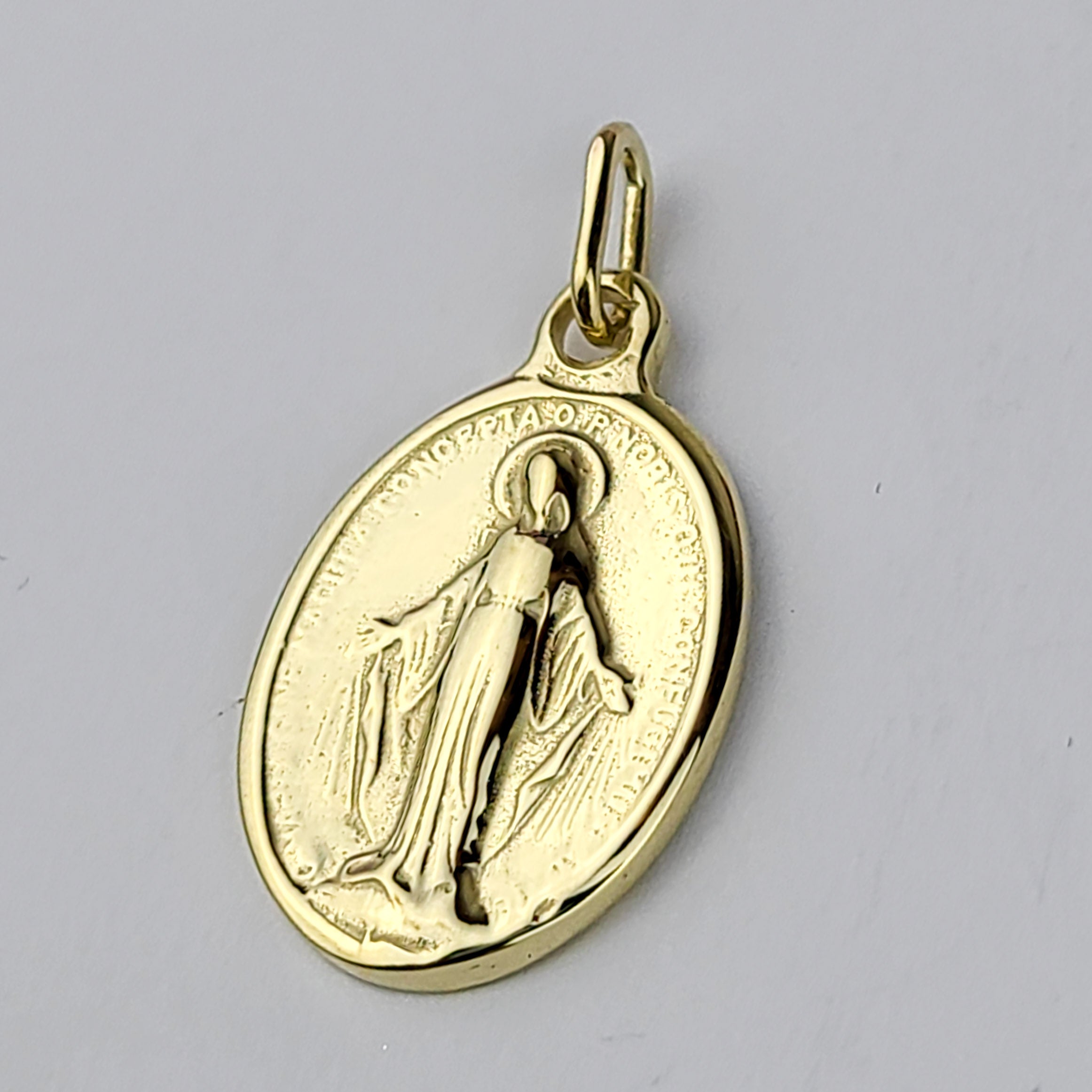 Collection of 10K - 14K Yellow Gold Mary Pendant in a gallery layout