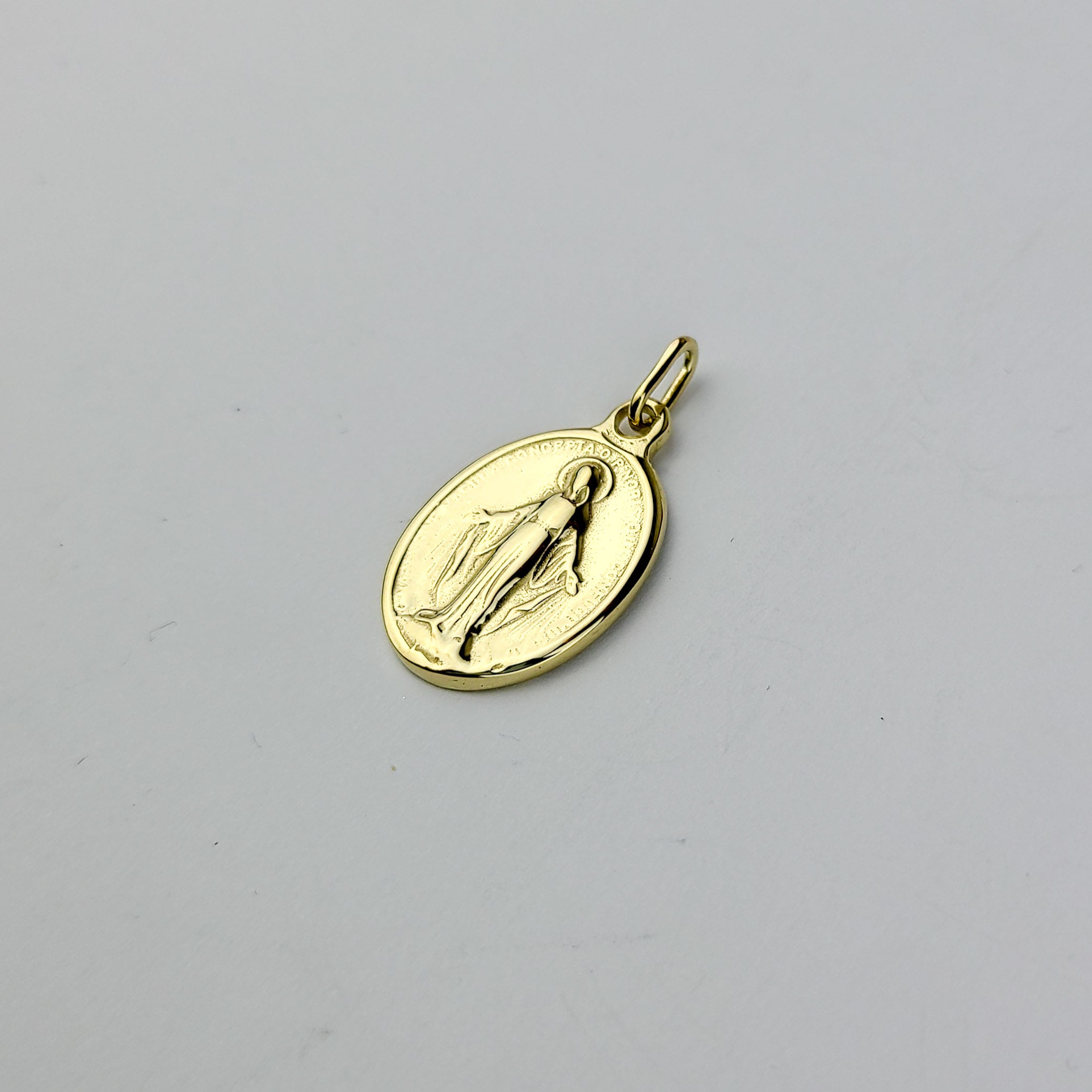 Collection of 10K - 14K Yellow Gold Mary Pendant in a gallery layout