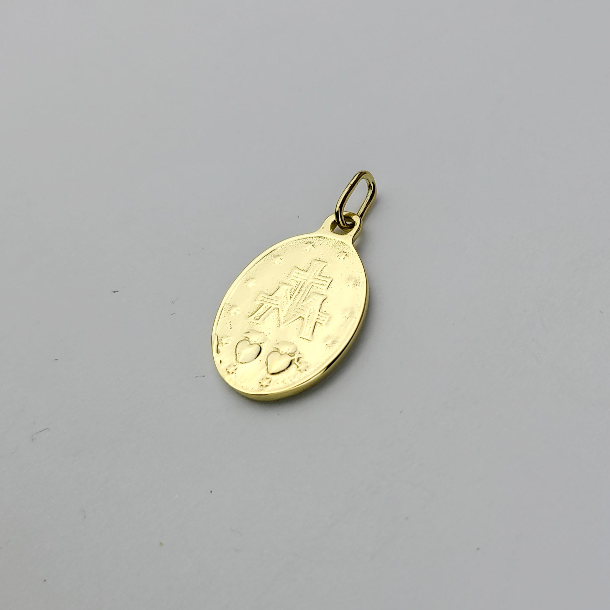 Collection of 10K - 14K Yellow Gold Mary Pendant in a gallery layout