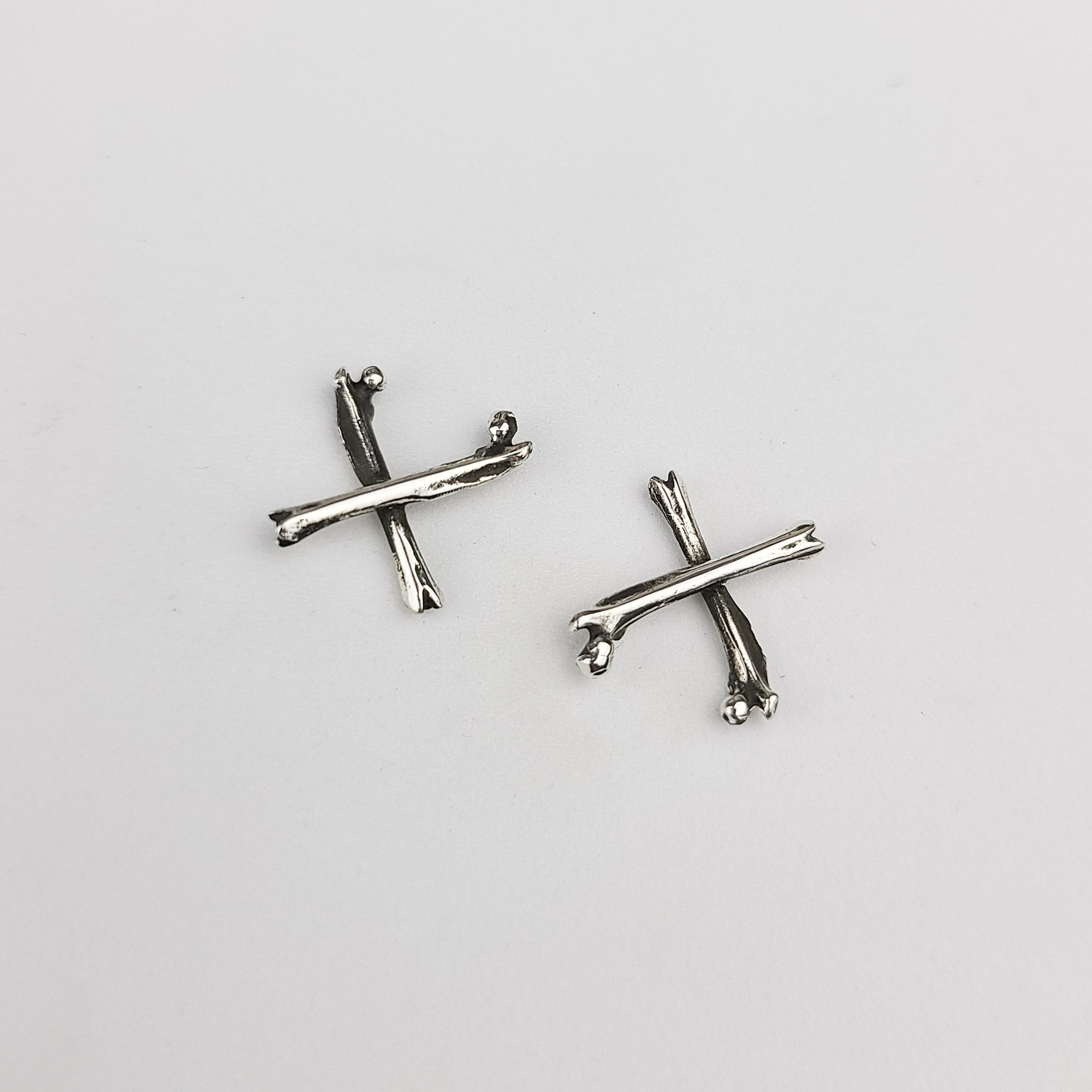 Collection of X Bone Earrings in a gallery layout