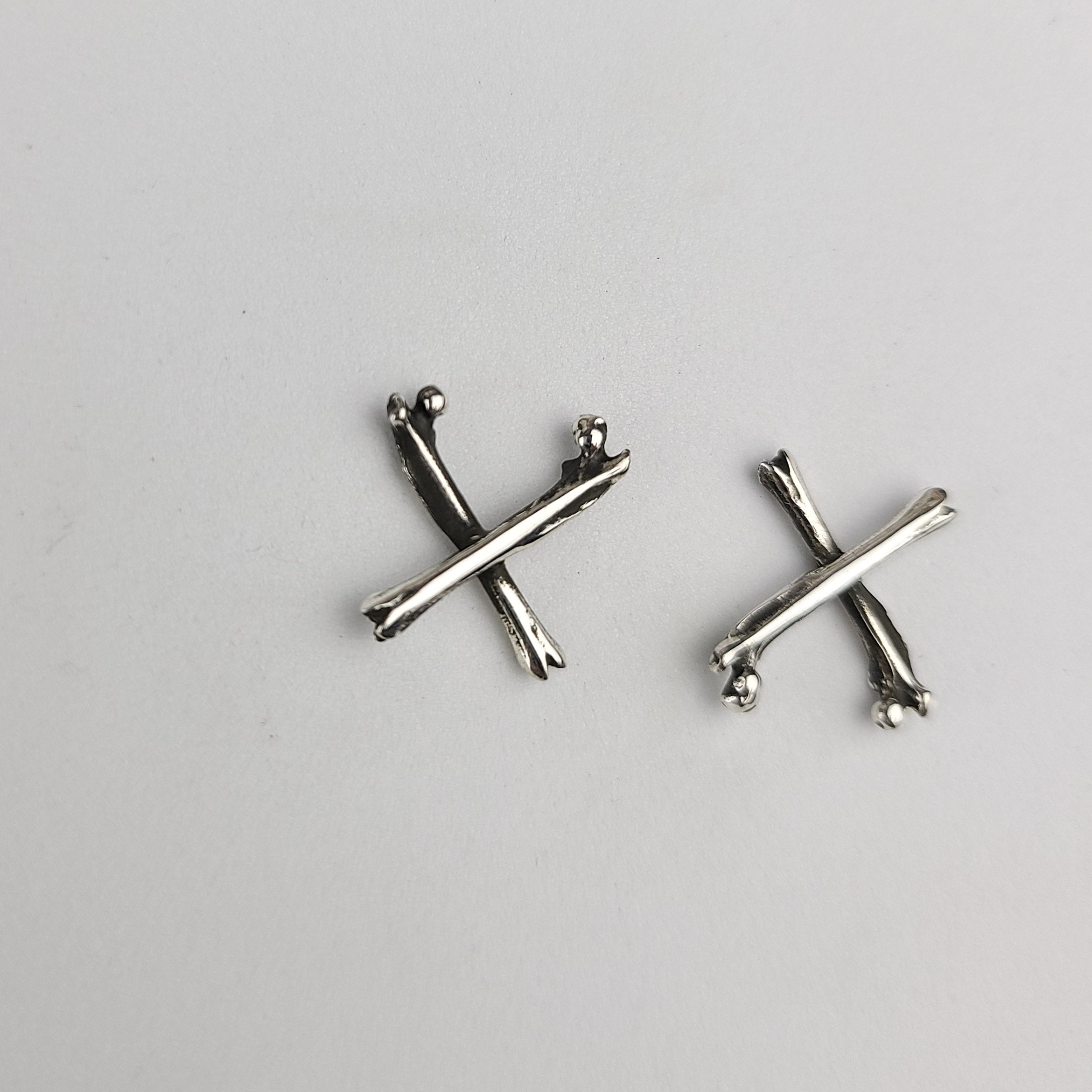 Collection of X Bone Earrings in a gallery layout