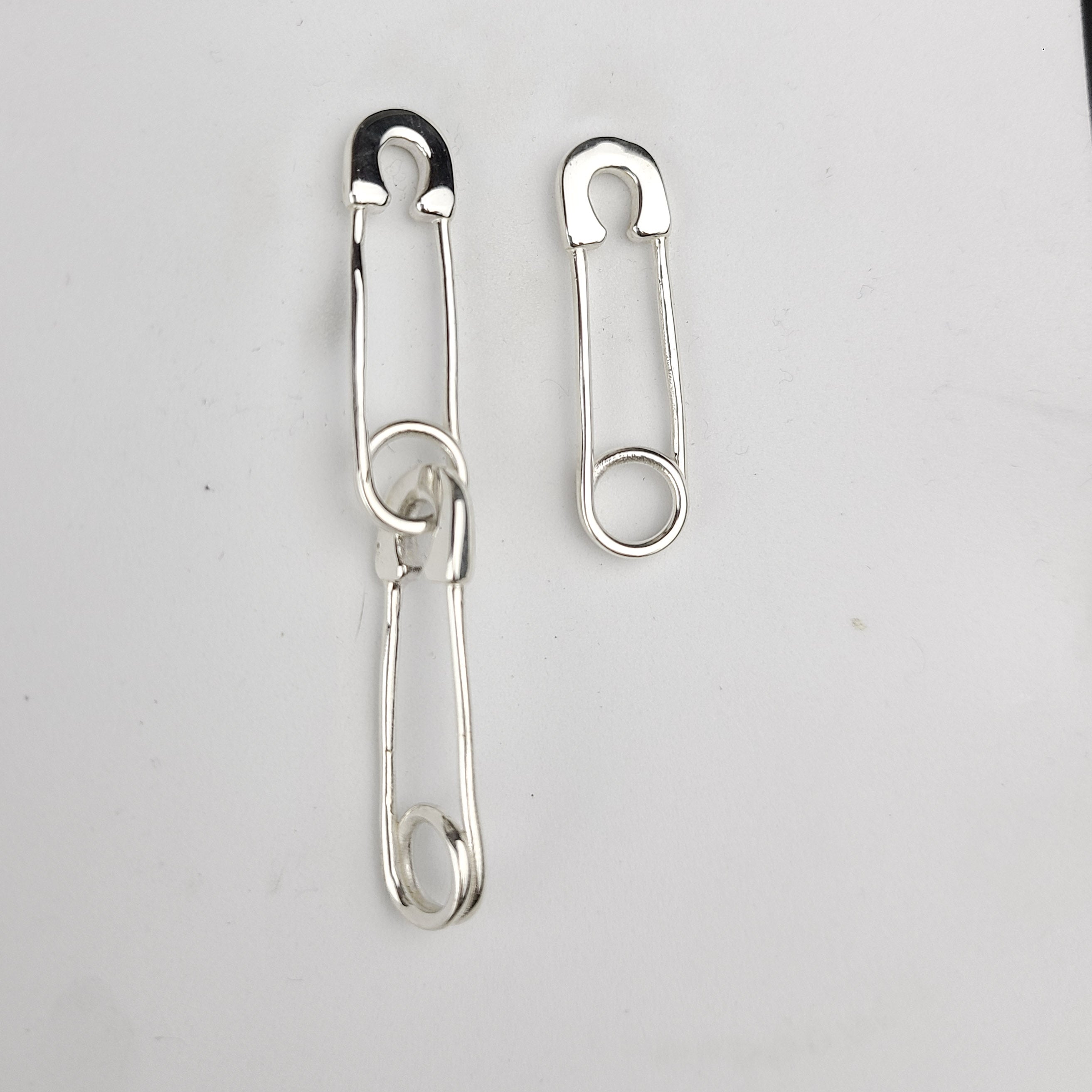 Collection of Safety Pins Asymetric Earrings in a gallery layout