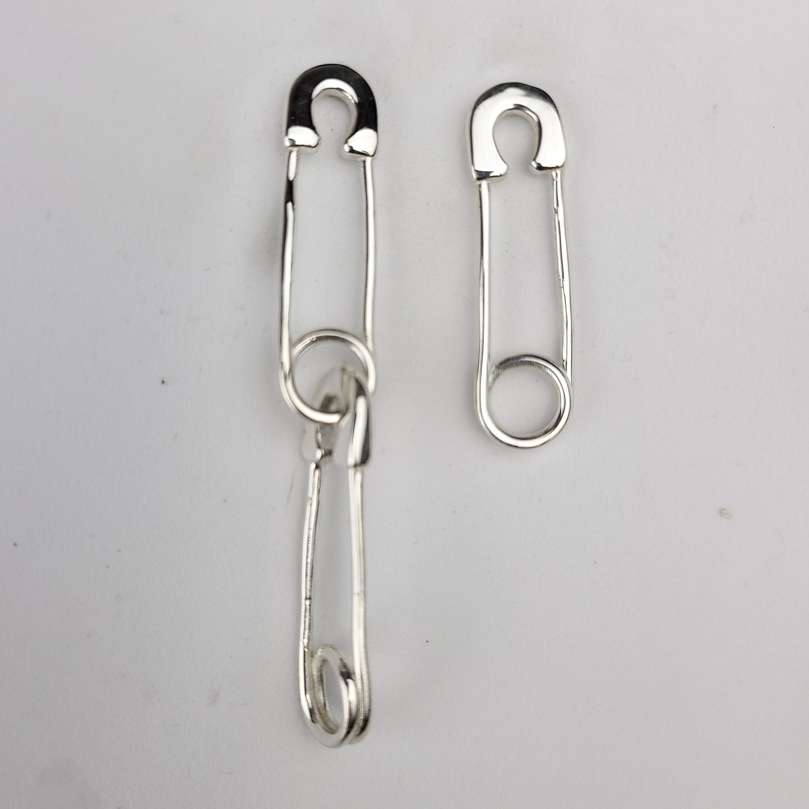 Collection of Safety Pins Asymetric Earrings in a gallery layout