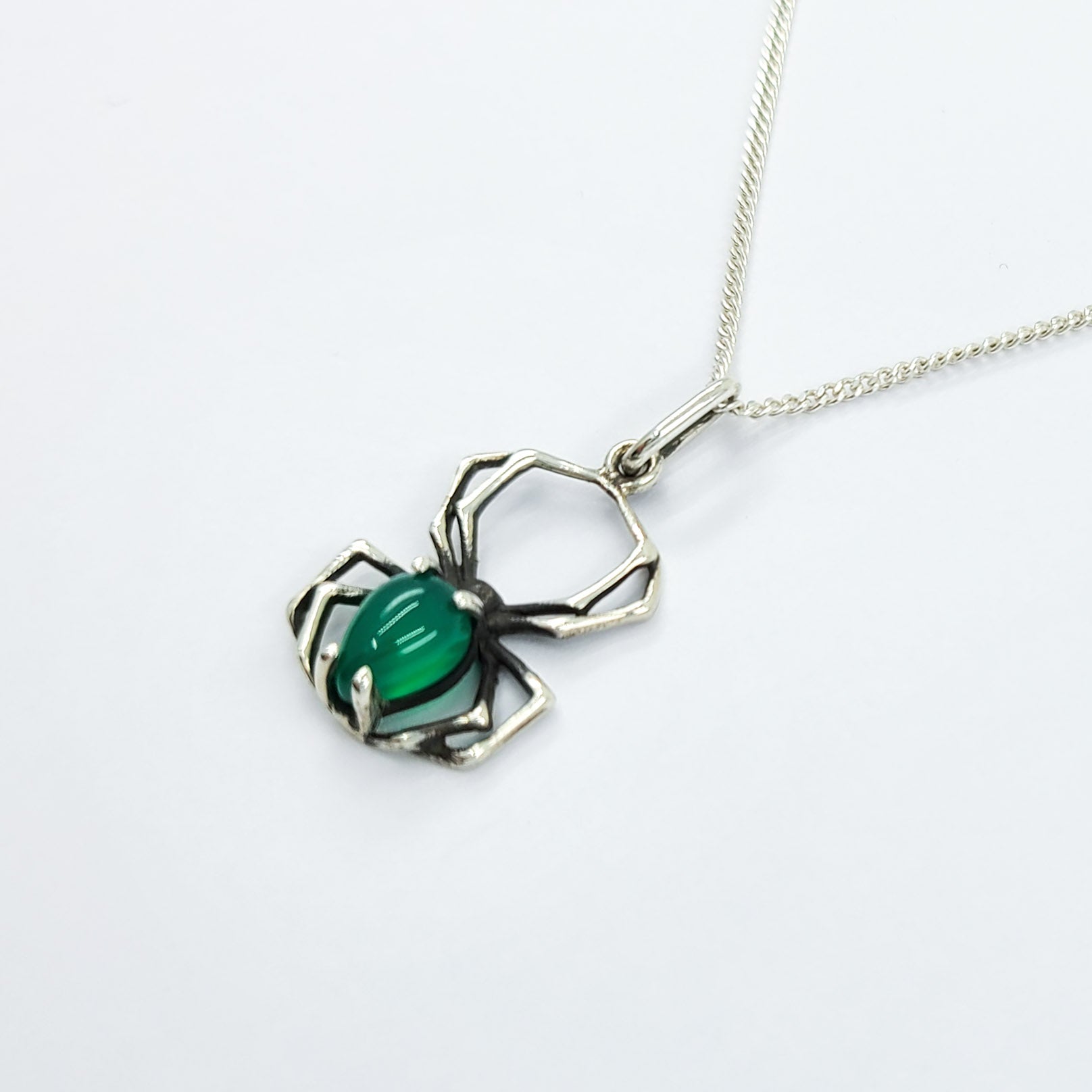 Collection of Glowing Green Onyx Spider Pendant in a gallery layout