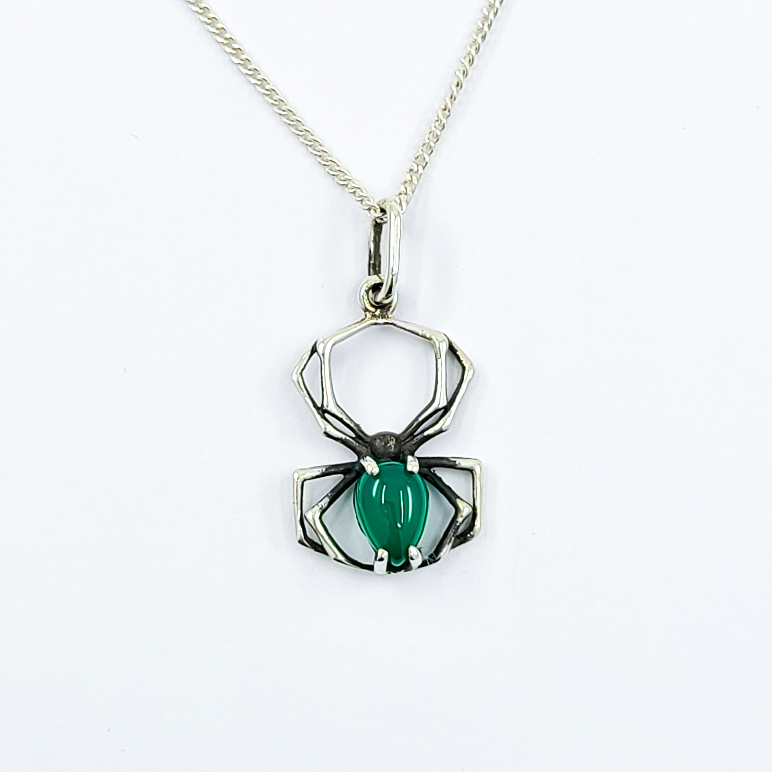 Collection of Glowing Green Onyx Spider Pendant in a gallery layout