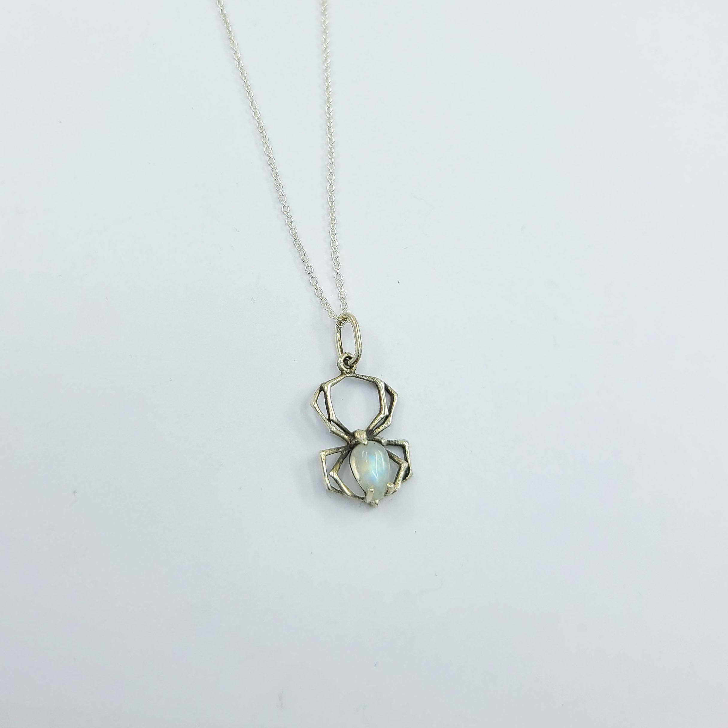 Collection of Rainbow Moonstone Spider Pendant in a gallery layout