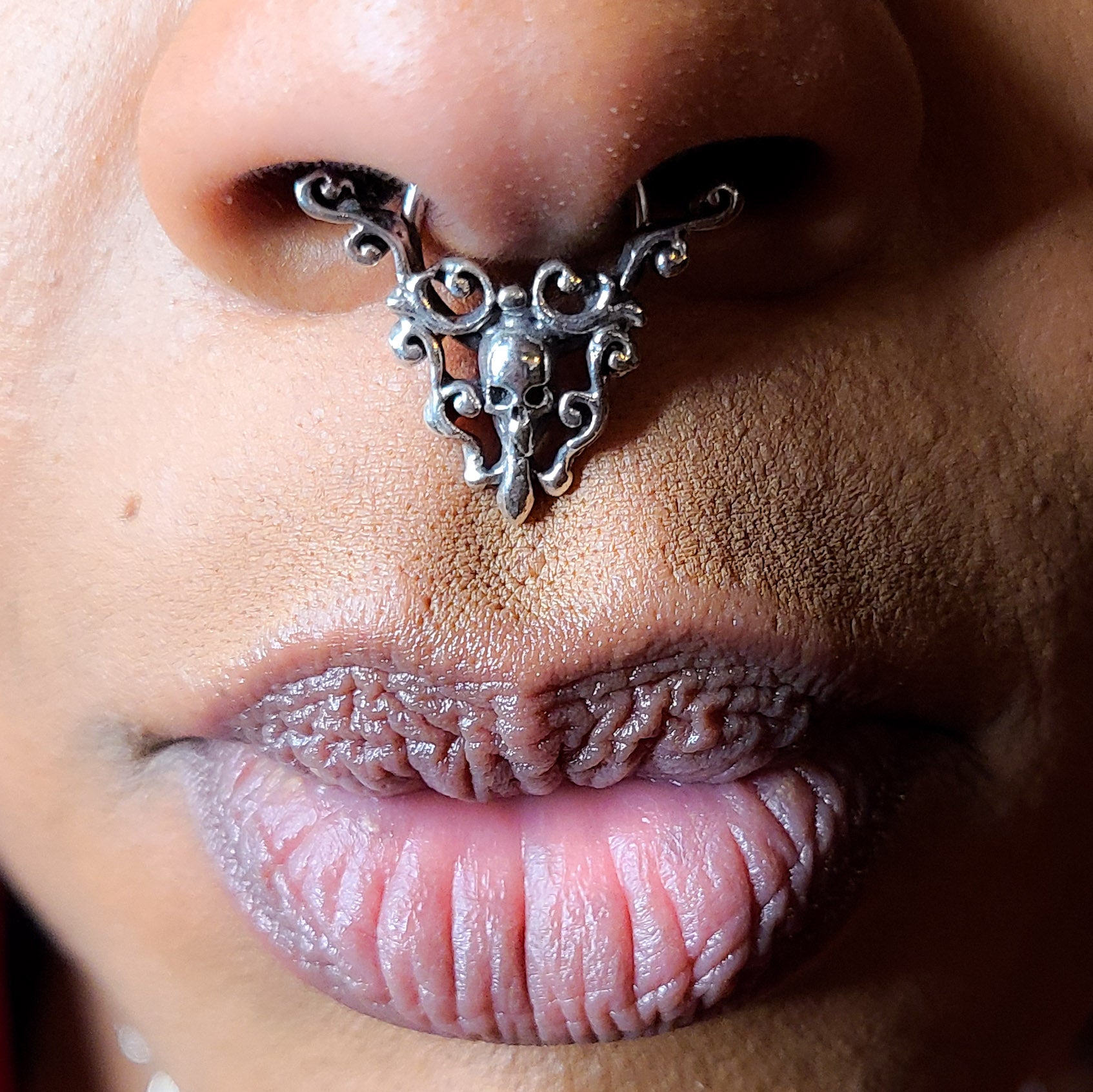 Collection of Skull and Lace Septum Piercing in a gallery layout