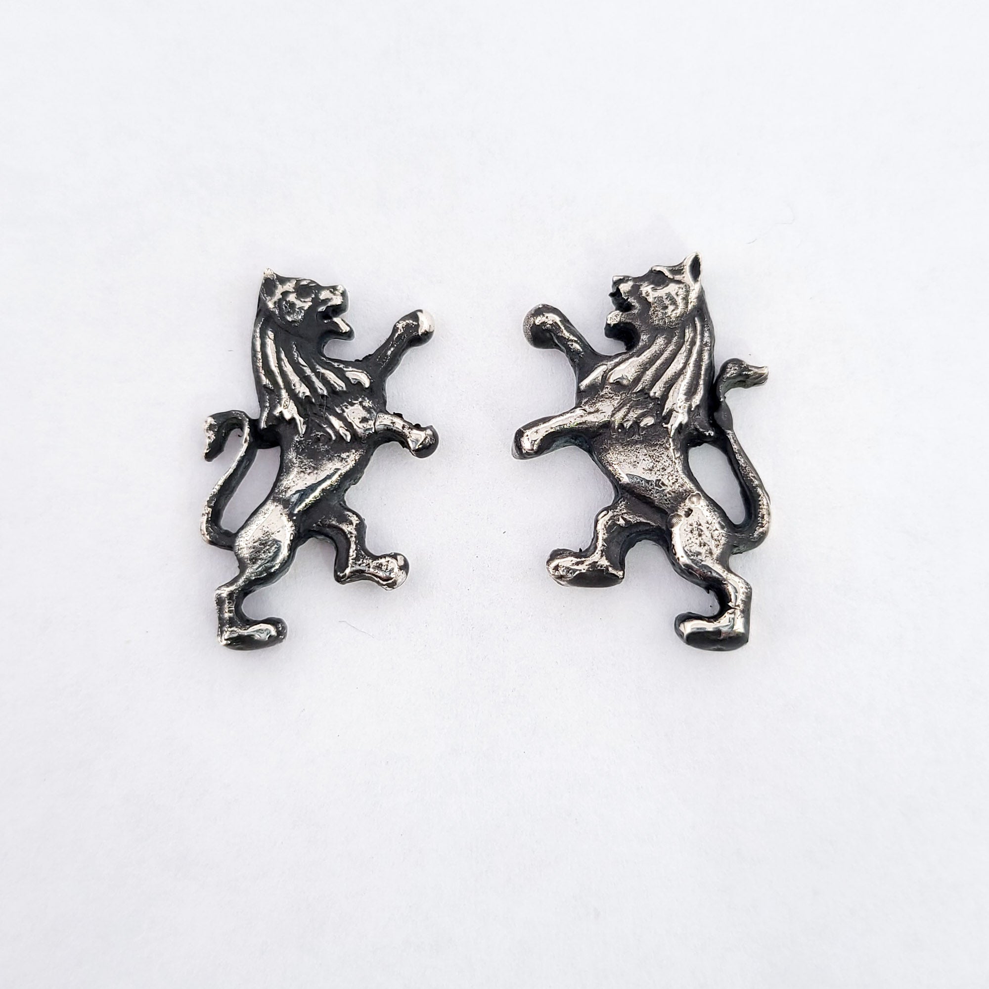 Collection of Silver Lion Earrings in a gallery layout