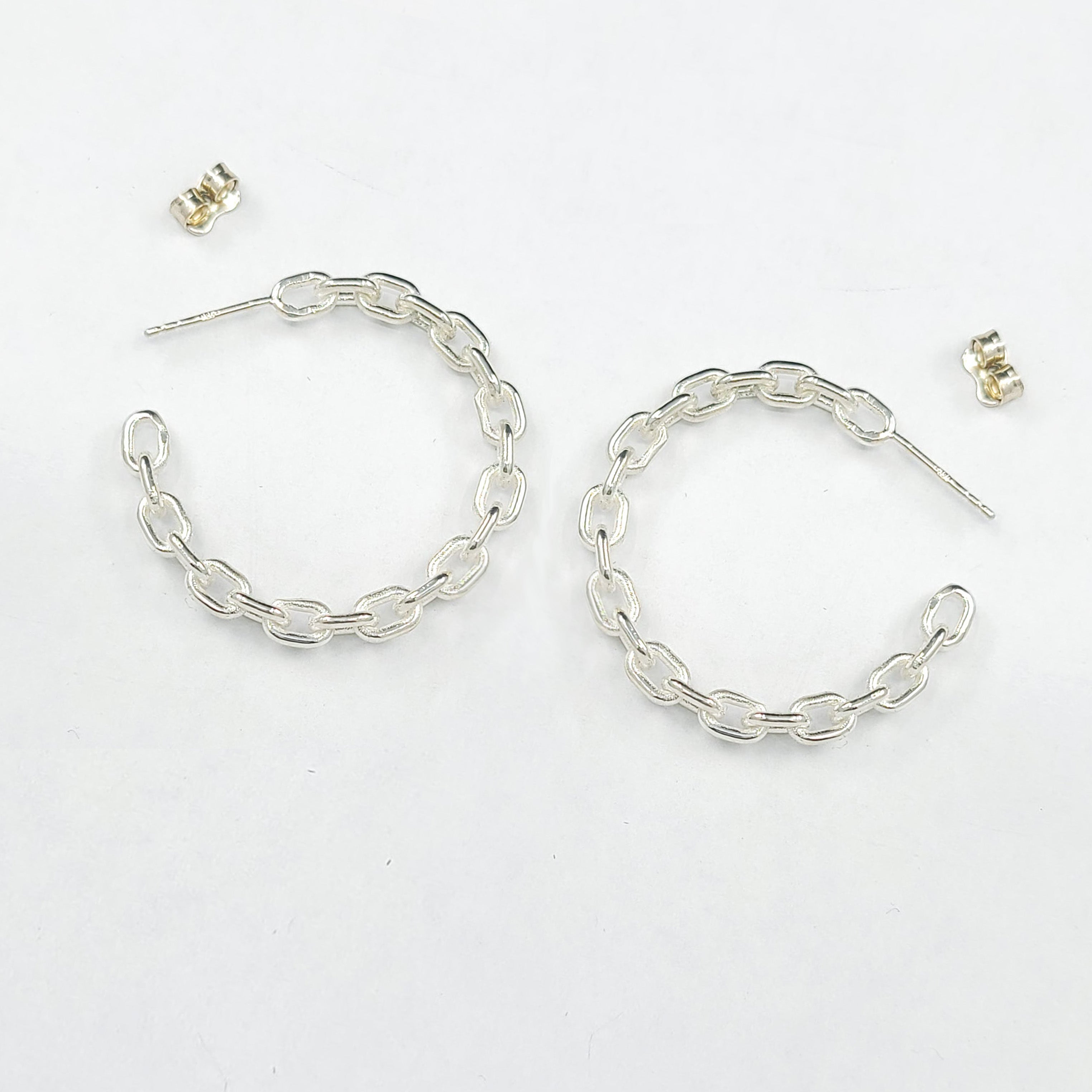 Collection of Sterling Silver Chain Hoops in a gallery layout