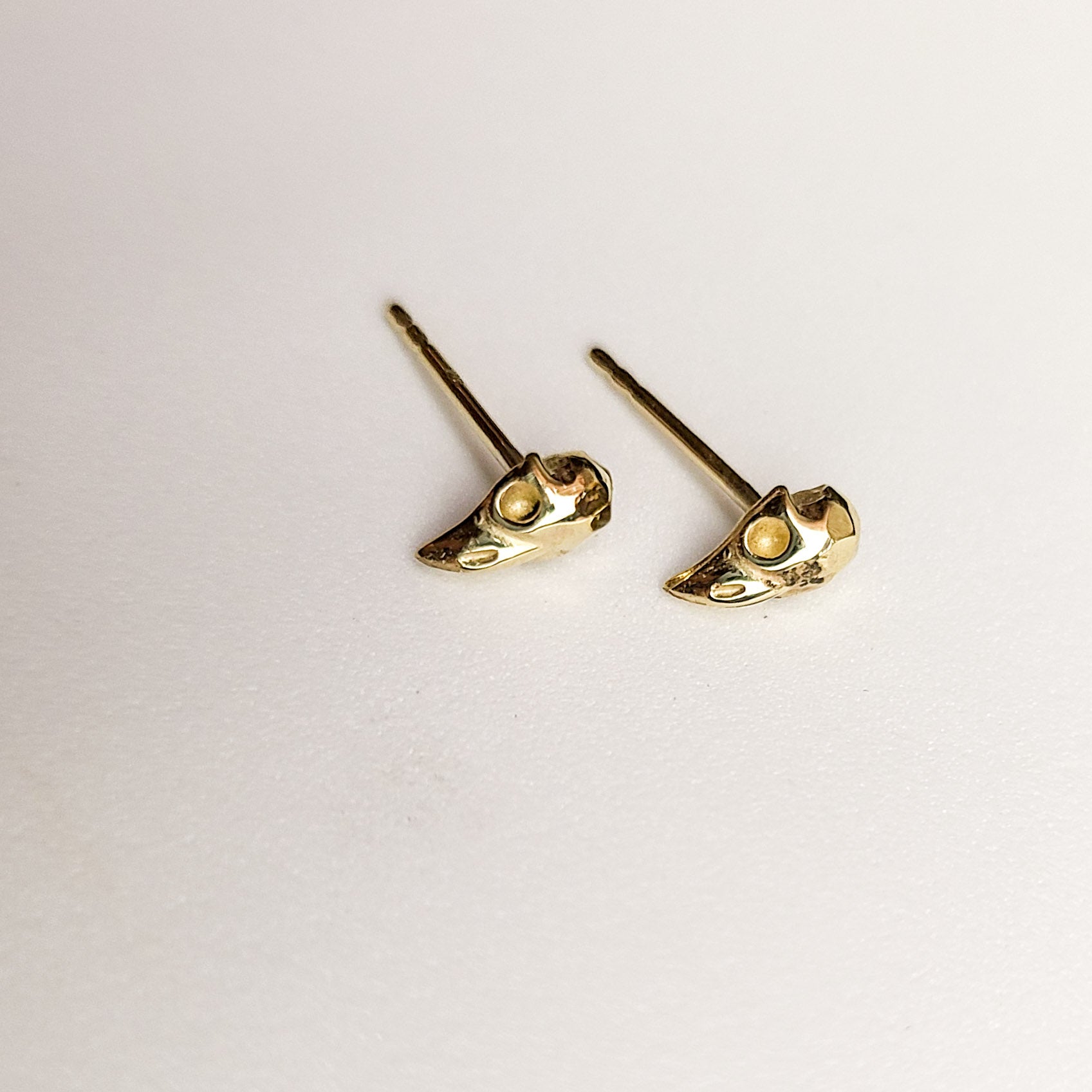 Collection of Yellow Gold Tiny Bird Skull Earrings 10K - 14K in a gallery layout