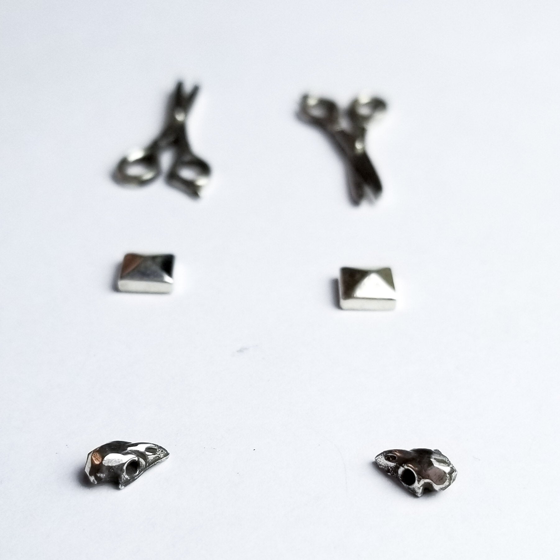 Collection of Set of 3 Pairs of Earrings #3 - Bird Skull, Scissors & Pyramid Studs - Inchoo Bijoux in a gallery layout